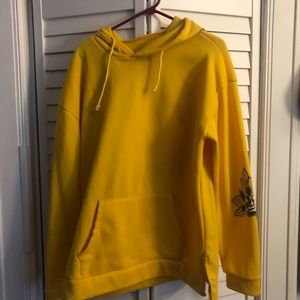 A light material yellow floral hoodie.